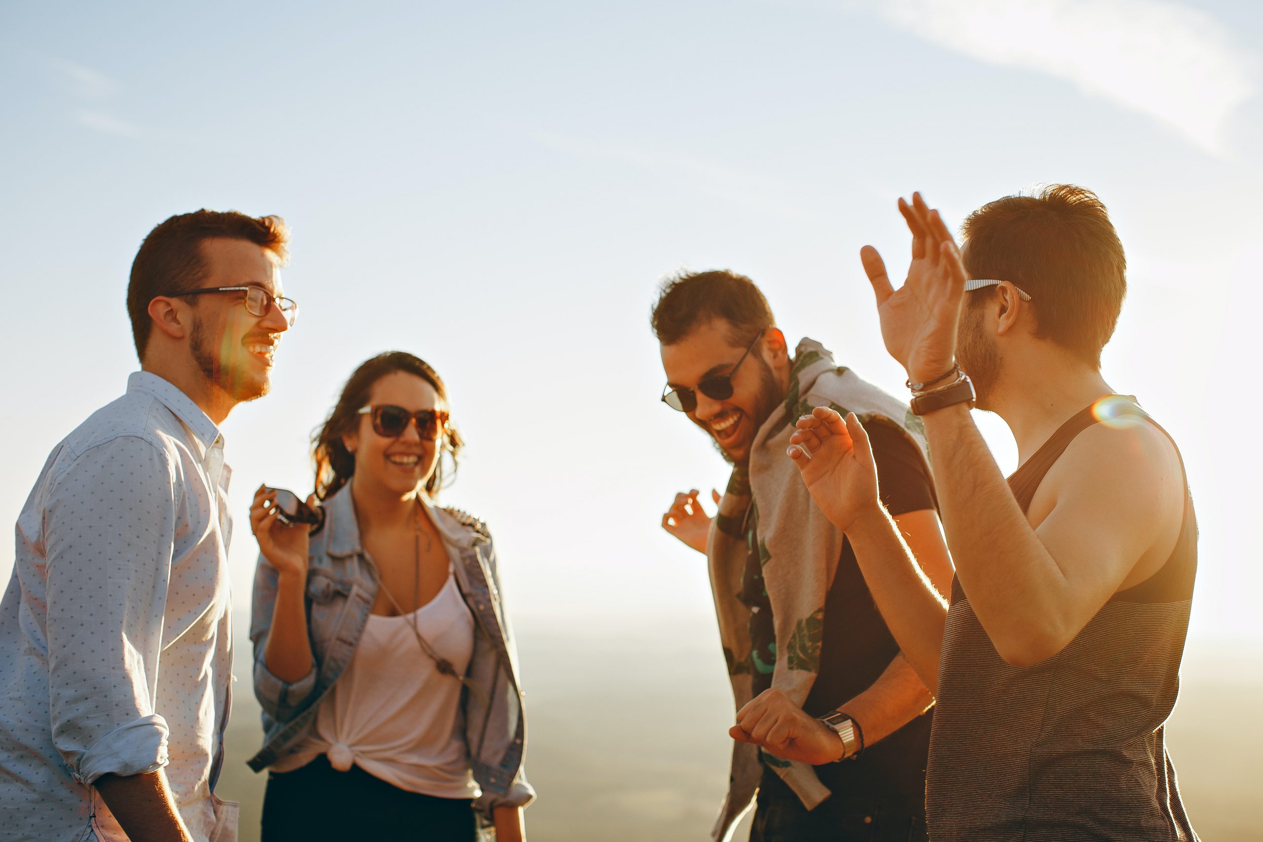 five forces 5 young people standing talking sun glasses