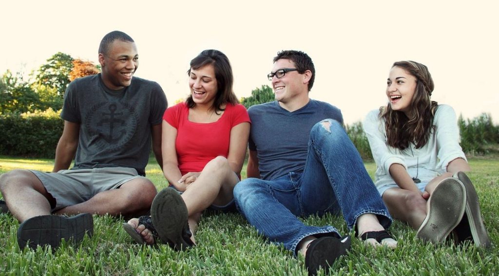 five forces young people on grass smaller